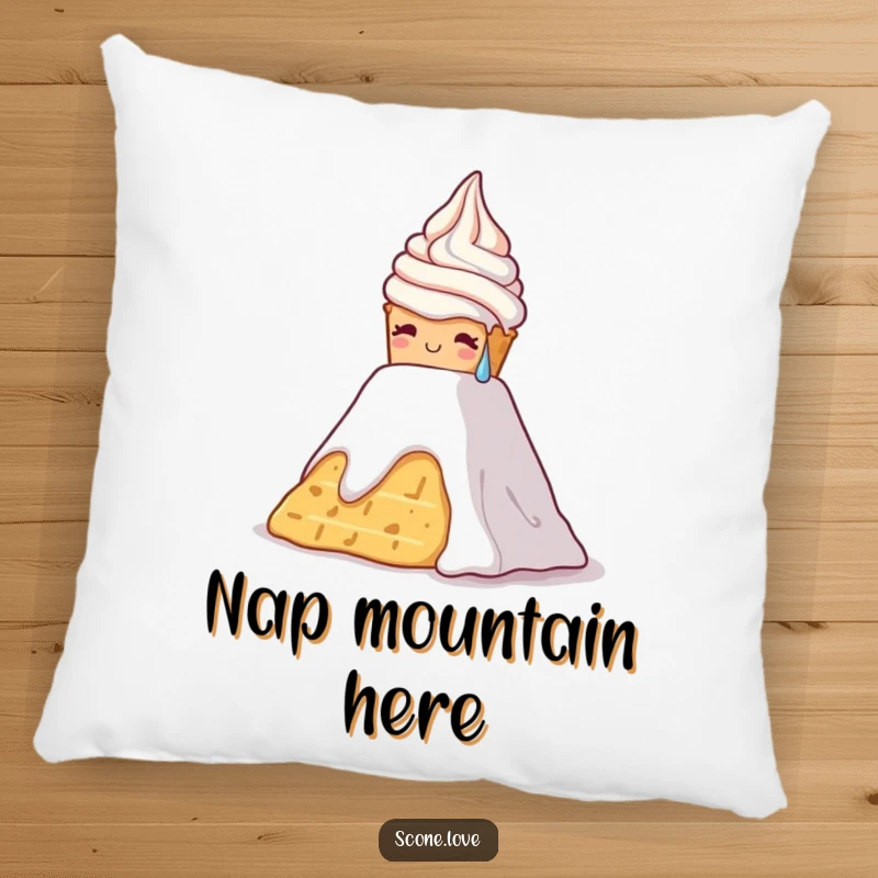 Funny pillow displaying a scone sweating and struggling up a whipped cream mountain, adding humor to decor.