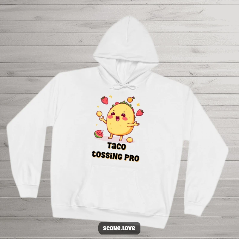 Funny taco hoodie showing a playful taco juggling fruit, perfect for staying warm and celebrating food.