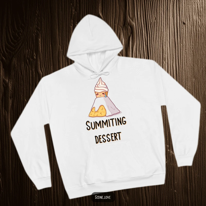 Funny hoodie featuring a scone, sweating, struggling to ascend a mountain of whipped cream, a humorous challenge.