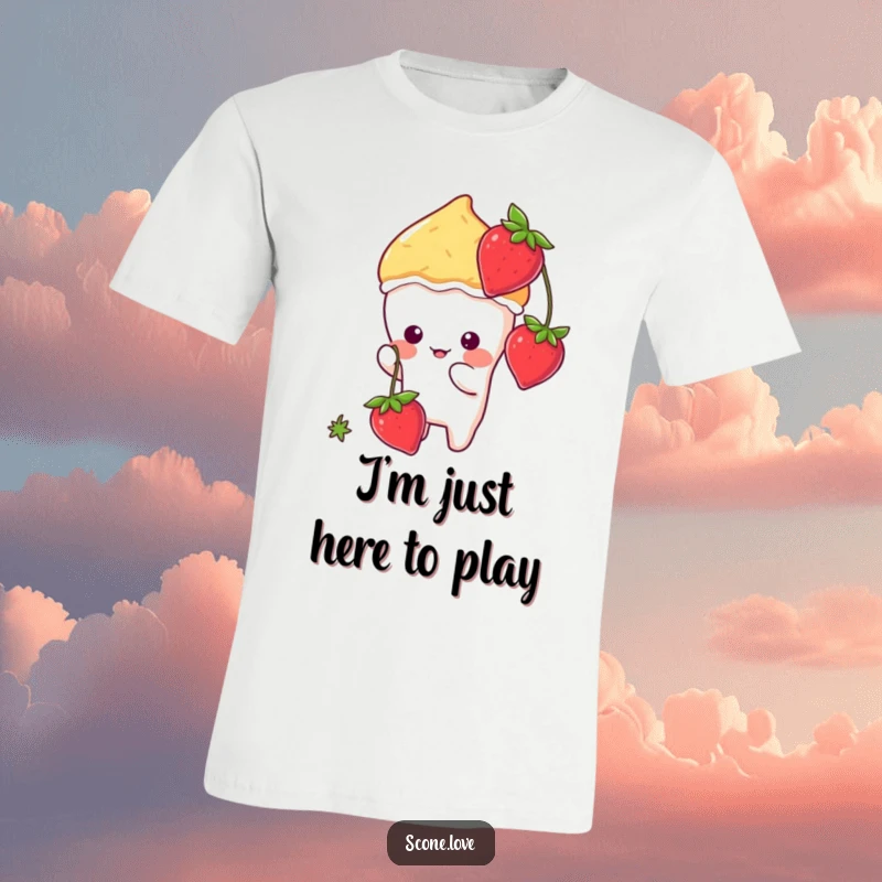 Funny kawaii scone character playfully swatting at a dangling strawberry on a comfortable graphic tee.