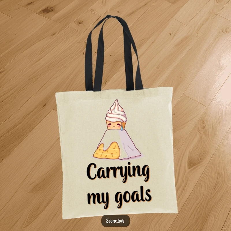 Funny tote bag showing a scone with sweat drops climbing a whipped cream mountain, a humorous take on effort.